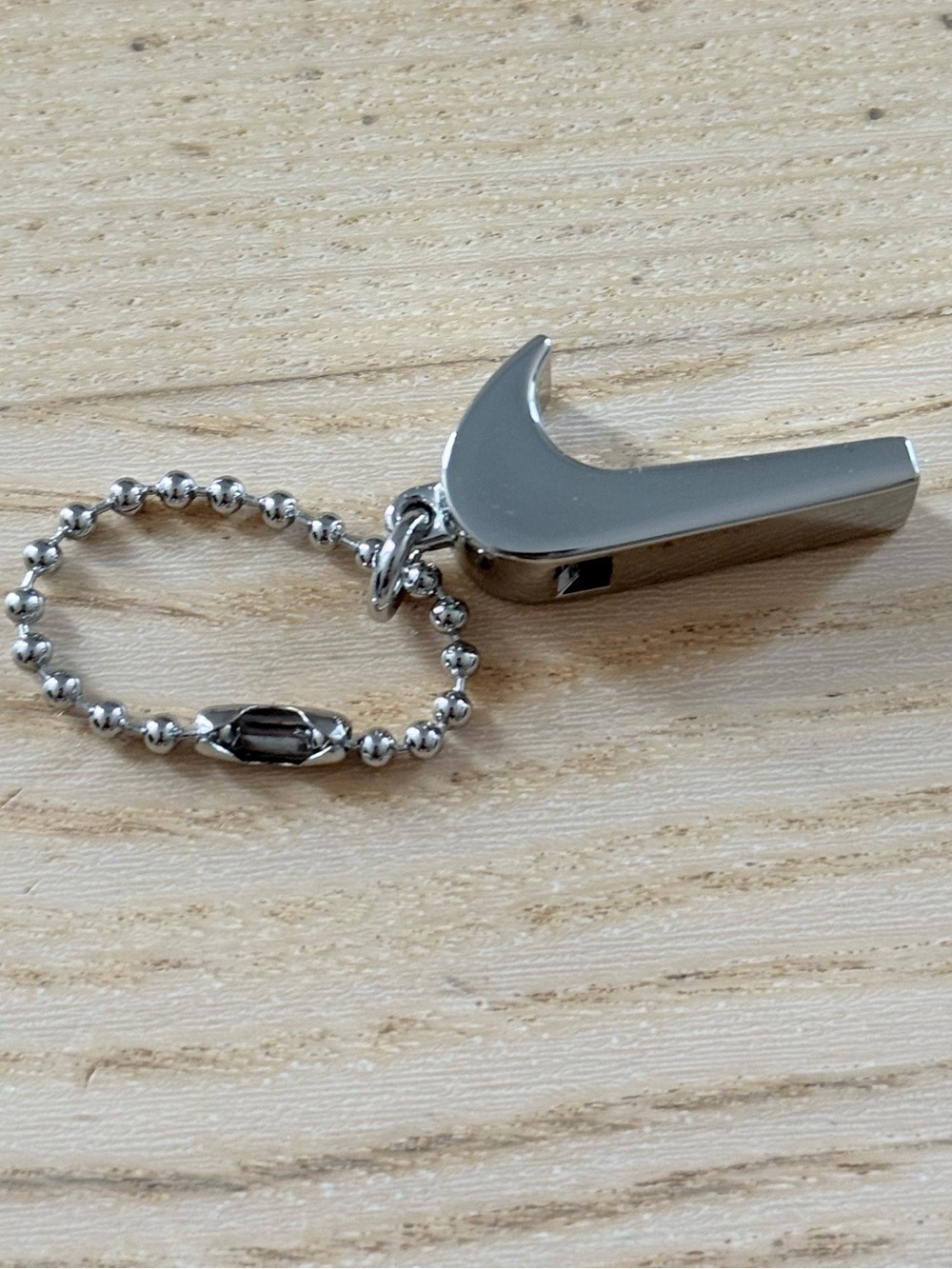 Nike Silver Swoosh Whistle Keychain